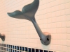 A whale towel hanger is beautifully placed to accent our Coastal bathrooms.