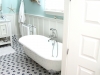 Floor tiles and clawfoot tubs are often used in our traditional Coastal homes from Thornhill Construction.